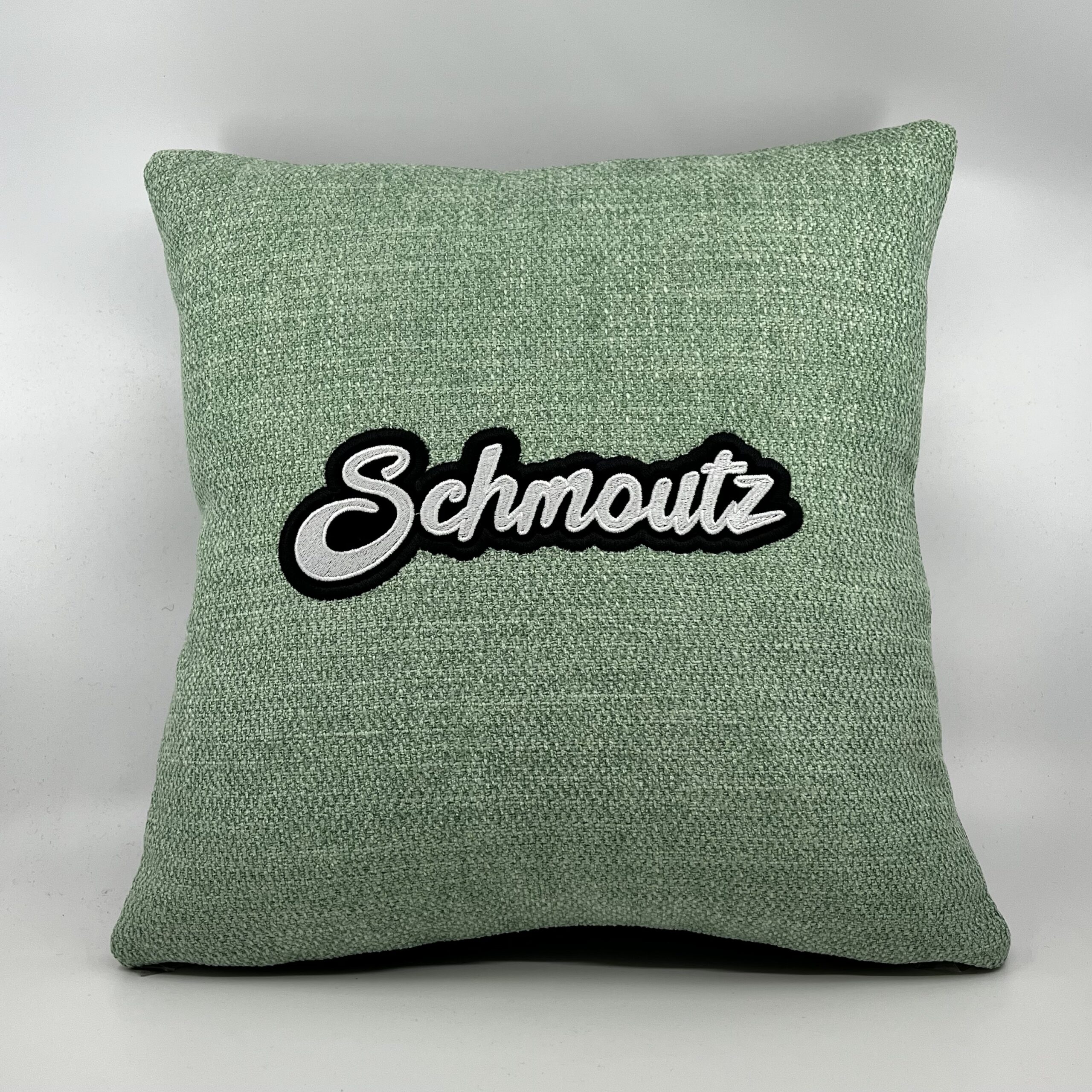 Coussin Schmoutz,
Toile vert d’eau