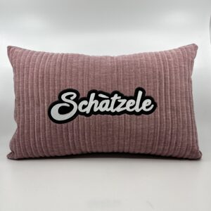 Coussin Schàtzele, velours côtelé rose.