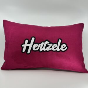 Coussin Hertzele, suédine fuchsia.