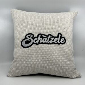 Coussin Schàtzele,
Toile blanche.