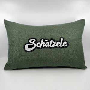 Coussin Schàtzele, toile verte irisée.